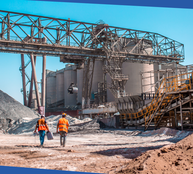 Two men walking to a drill site